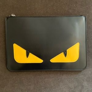 FENDI black and yellow pouch.